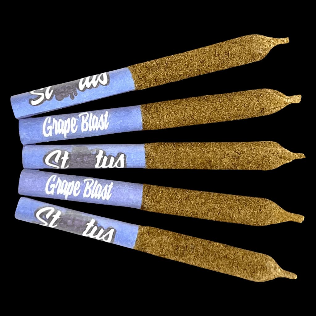 Five Status Grape Blast cannabis pre-rolls with blue paper wraps and kief-coated rolling paper, arranged in parallel rows