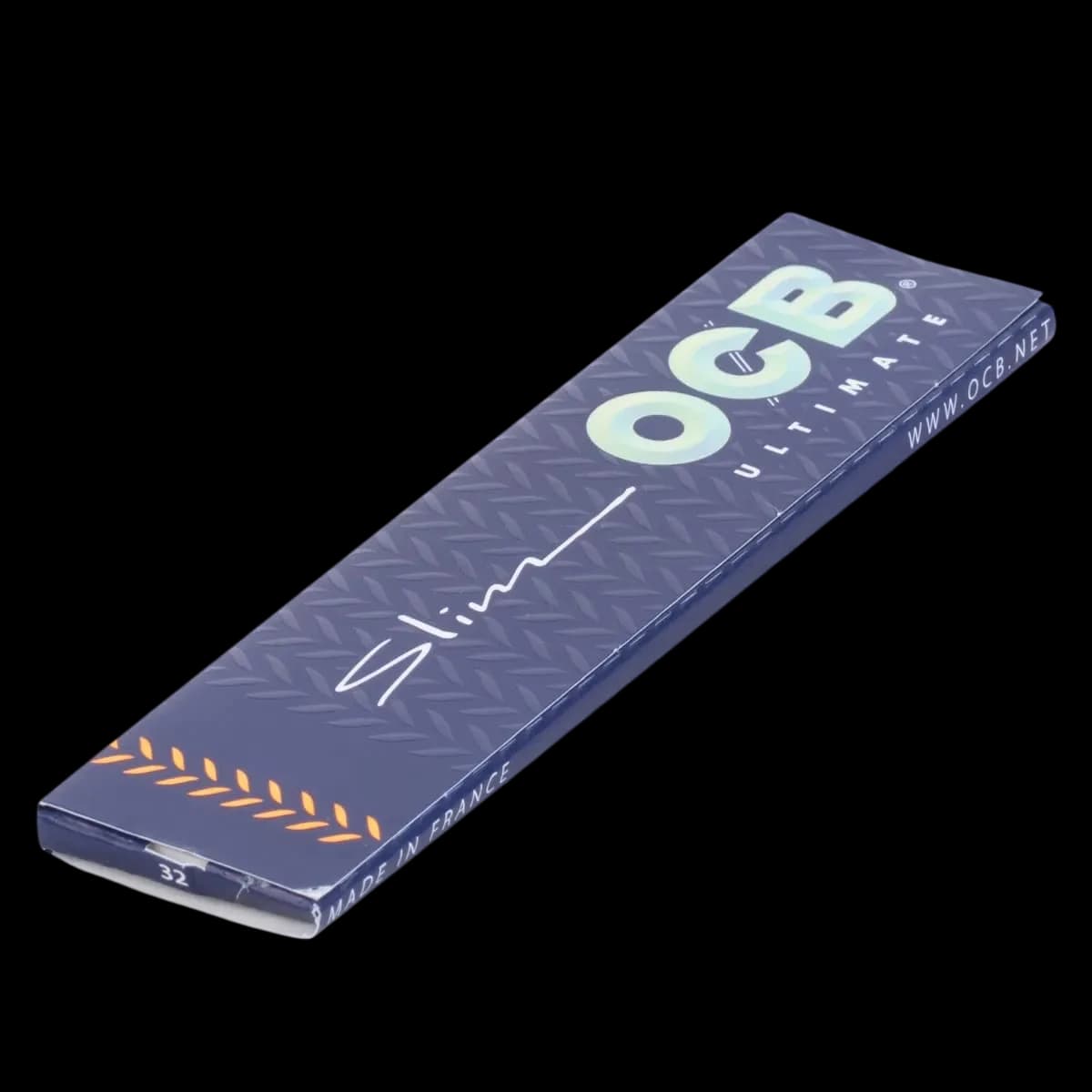 OCB Ultimate King Slim rolling papers, 32 leaves per pack, navy blue packaging with geometric pattern