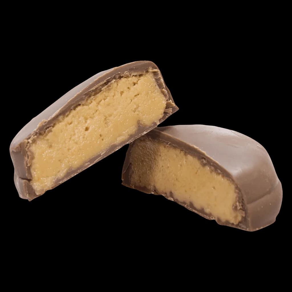 Balcony 1:1 Peanut Butter Bites cannabis chocolates, two pieces showing peanut butter filling inside dark chocolate shell