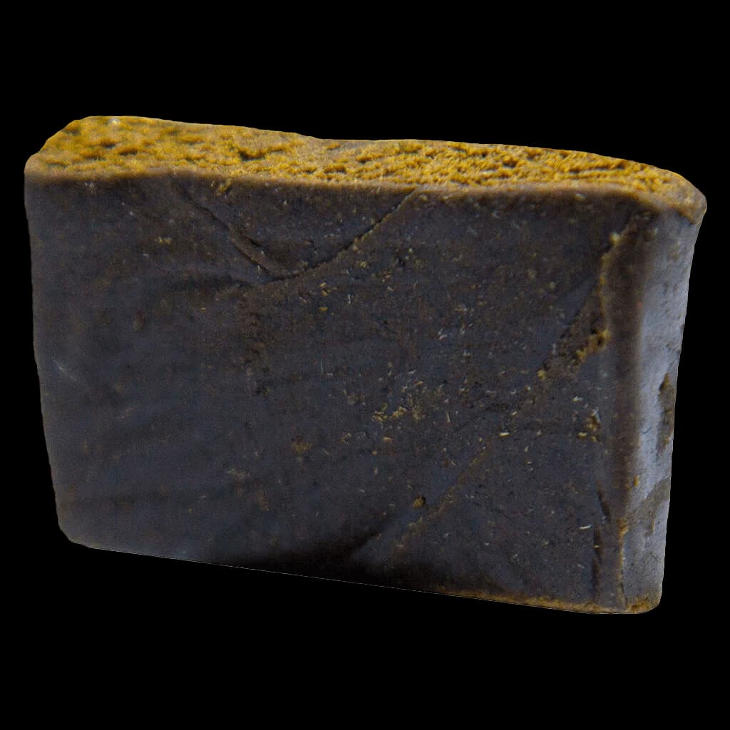 Sage n' Sour Hash by MTL Cannabis, dark charcoal-colored block with golden-brown surface texture, cannabis concentrate product