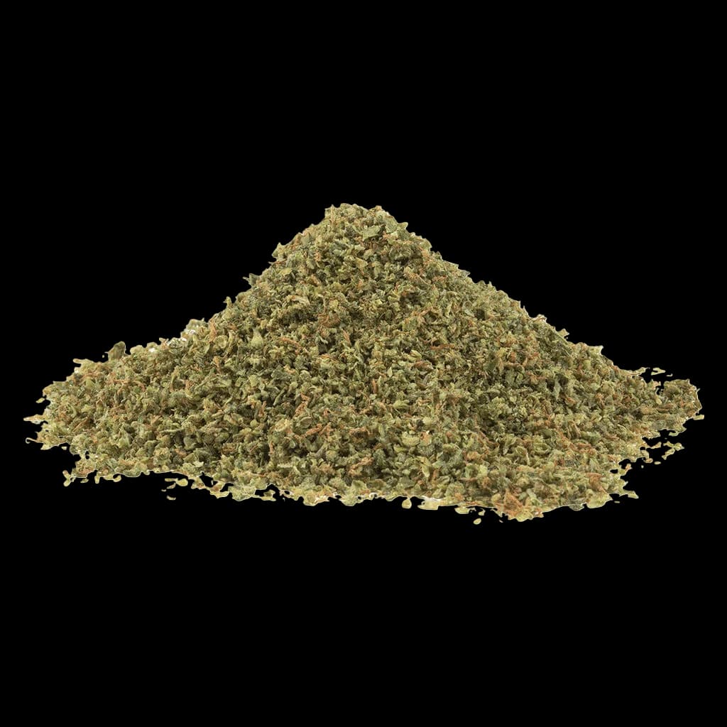SHRED Tropic Thunder cannabis dried flower, loosely piled heap showing green and tan flower material