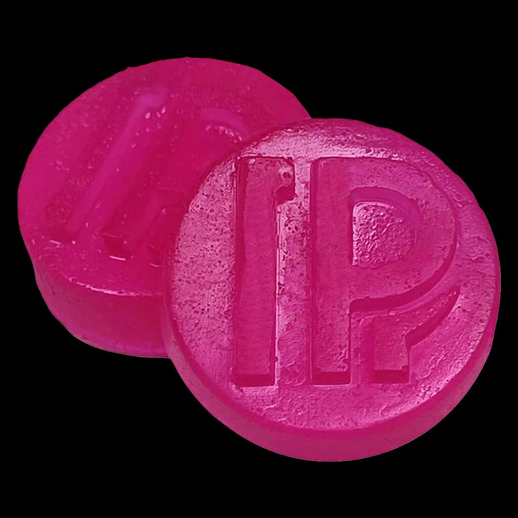 Pistol and Paris Pink Goo Live Rosin Gummies, two magenta soft chews with embossed branding